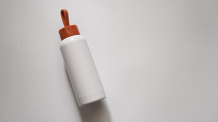 Bottle for baby food or for water on a white background