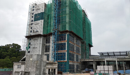 Fototapeta premium KUALA LUMPUR, MALAYSIA -MARCH 7, 2020:The construction site is operating during the day. Workers are busy carrying out their activities as planned under the supervisor's supervision.