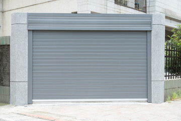 A closeup shot of automatic metal roller door used in factory, storage, garage, and industrial...