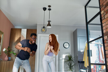 crazy married couple dance, have fun together at home. cute crazy couple happy together, enjoy weekends. love, relationships, emotions, happiness concept