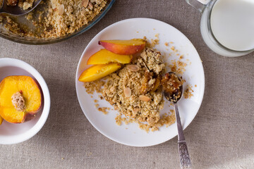 Peach crumble in plate. Top view.