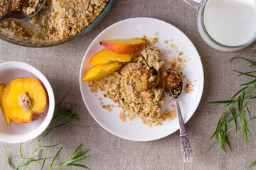 Peach crumble in plate. Top view.