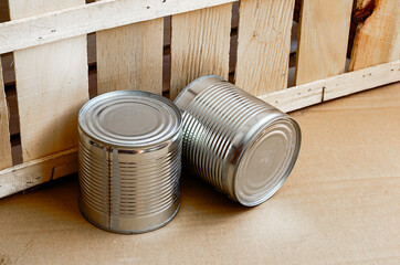 Two metal shut jars of ready-to-eat food.