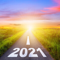 New Year Goals Concept : Empty asphalt road sunset and Happy New Year 2021.