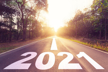New Year Goals Concept : Empty asphalt road sunset and Happy New Year 2021.
