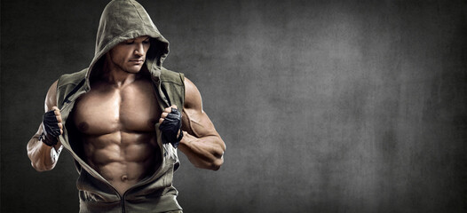 portrait bodybuilder man on grey background