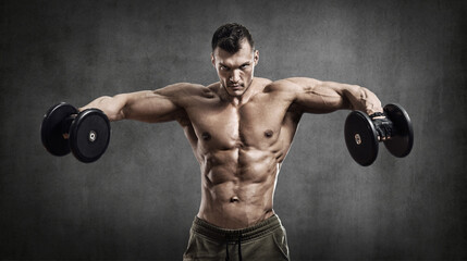 Fototapeta na wymiar man - bodybuilder, execute exercise with weight dumbbells