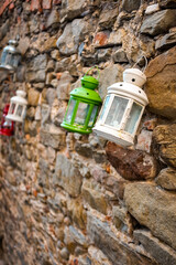 Lanterns on a stone wall