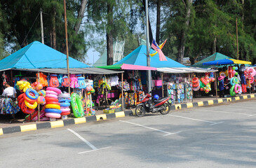 Port Dickson, Malaysia -May 08, 2016: Stalls selling buoys and other water games for children near...