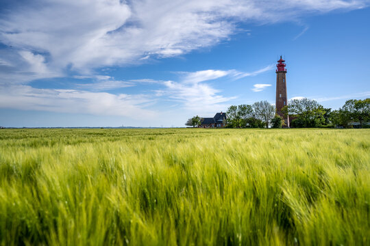 The beautiful Lighthouse Of Fl&uuml;gge On The Isle Of Fehmarn at the Baltic Sea in Germany. Summer in Germany.