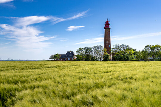 The beautiful Lighthouse Of Fl&uuml;gge On The Isle Of Fehmarn at the Baltic Sea in Germany. Summer in Germany.
