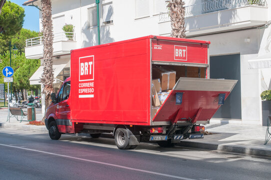 A BRT (Bartolini) express courier van parked in the city during a delivery