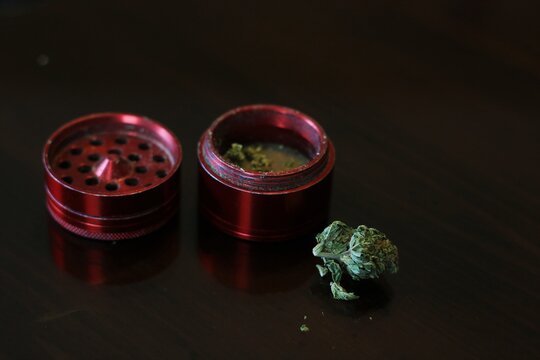 nugget of weed with red grinder 