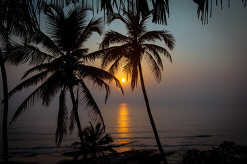 Naklejka na ściany i meble sunset over sea goa india
