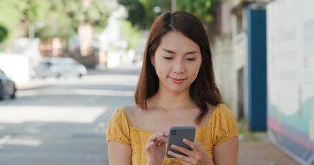 Woman use of cellphone at street