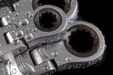 Ratchet wrench for loosening screws. Wet tools in the workshop.