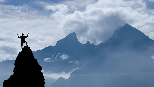 Male climber on a rock in front of mountain watzmann
