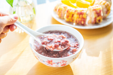 Chinese nutritious breakfast with red bean porridge and corn