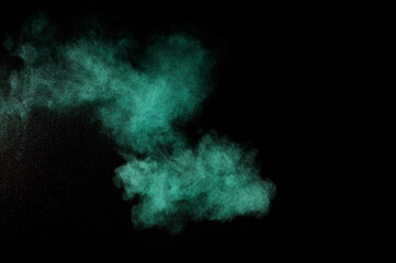 Aquamarine powder explosion on black background. Colored powder cloud. Colorful dust explode. Paint  Holi.