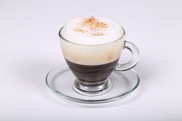 Delicious coffee  in a glass cup on a white background