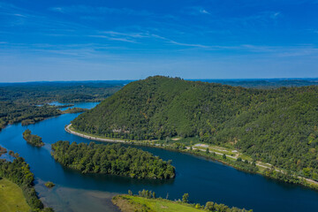 Fototapeta na wymiar landscape with river, mountains, and blue sky