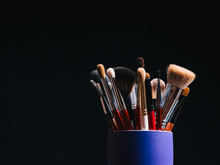 set of professional makeup brushes close up with copy space