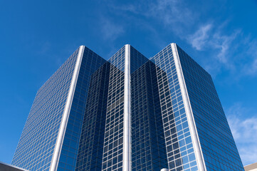 Generic office building concept with blue sky. 