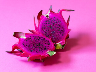 Pink pitahaya on a pink background. Close up.