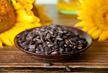 Sunflower seed on the plate on the wooden table