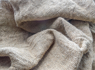 burlap texture fabric in folds background close up