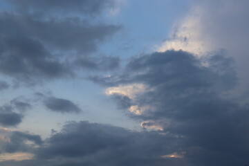 Fototapeta na wymiar white and black clouds in the blue sky