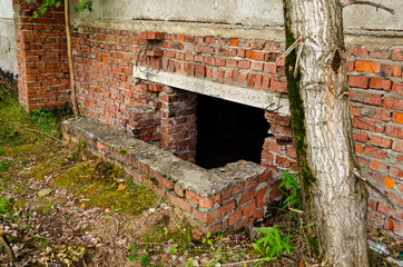 We're building in a brick wall on the basement floor, catacombs, abandoned building, entrance to...