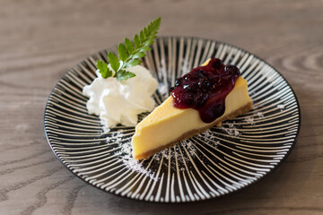 blueberry New York cheesecake on wooden table