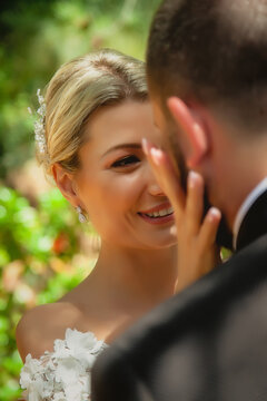 Portrait of bride and groom in close-up. Happy young family. Man and woman love each other. Selective focus. Diagonal image. Amazing guys. Couple show emotions. Blonde with blue eyes