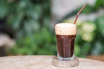 A glass of ice black coffee cafe