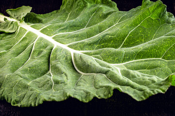 large kale leaves, loose and green, used in cooking.