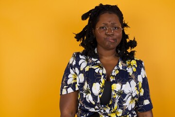 Beautiful young woman nervous and scared biting lips looking camera with impatient expression,...