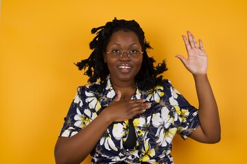 I swear, promise you not regret. Portrait of happy, sincere girl raising one arm and hold hand on...
