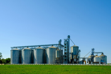 Agricultural Silos. Building for storage and drying of grains, wheat, corn. Agribusiness concept.