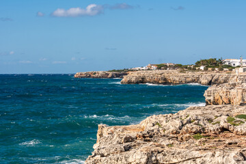 Blue sea water and rocky coast of west Menorca, Ciutadella port. Menorca, Spain