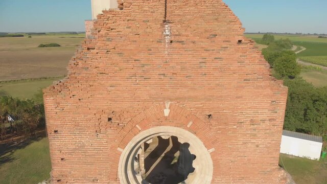 Aerial rise and pan down of the remnants of Araca church in Novi Becej, Serbia.