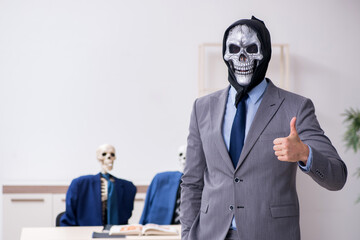 Funny business meeting with devil and skeletons