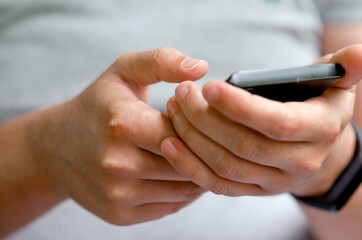 Hands are holding the phone.
