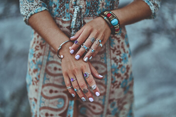 Bohemian chic gypsy woman with manicure wearing jewelry accessories and dress. Boho detail close up