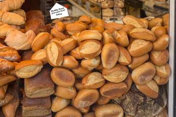 Fresh bread rolls and loaf of bread in bakery window