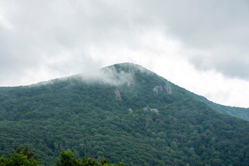 Naklejka na ściany i meble clouds over the mountain