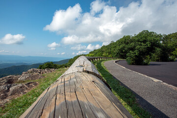 wooden fence along with the hill road	