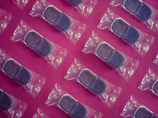 Ice cream in plastic pattern on purple background