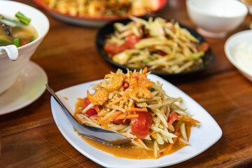 Som tam thai, spicy papaya salad with dried shrimp and nut.