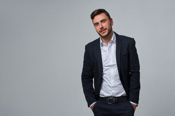 Close up portrait young man businessman. Caucasian guy business suit studio gray background.